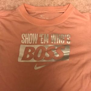 this is a pretty pink colored nike shirt.